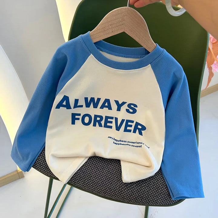 Children's blue and white shirt with 'ALWAYS FOREVER' text on a hanger.
